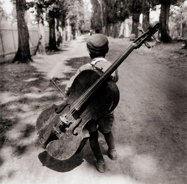 Eva Besnyö - boy with a violoncello ,1931